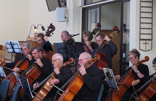 Lower strings and organist