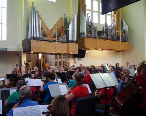 Across strings to organ